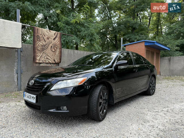 Черный Тойота Камри, объемом двигателя 2.36 л и пробегом 300 тыс. км за 7600 $, фото 1 на Automoto.ua