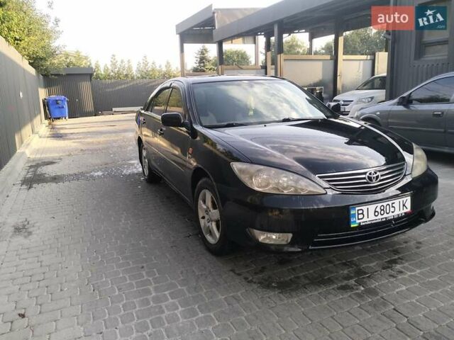 Чорний Тойота Камрі, об'ємом двигуна 2.4 л та пробігом 313 тис. км за 7200 $, фото 5 на Automoto.ua