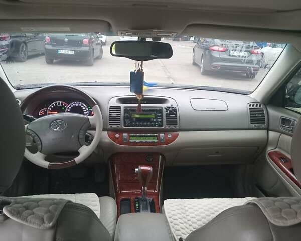 Чорний Тойота Камрі, об'ємом двигуна 2.36 л та пробігом 270 тис. км за 6100 $, фото 10 на Automoto.ua