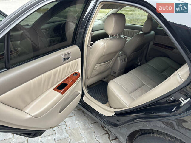 Чорний Тойота Камрі, об'ємом двигуна 2.36 л та пробігом 294 тис. км за 5100 $, фото 12 на Automoto.ua