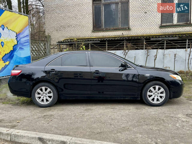 Черный Тойота Камри, объемом двигателя 2.4 л и пробегом 313 тыс. км за 6950 $, фото 1 на Automoto.ua