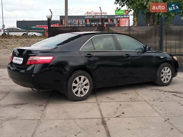 Черный Тойота Камри, объемом двигателя 2.4 л и пробегом 304 тыс. км за 6990 $, фото 6 на Automoto.ua