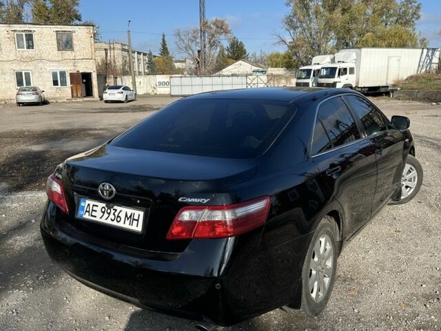 Чорний Тойота Камрі, об'ємом двигуна 2.4 л та пробігом 251 тис. км за 8899 $, фото 1 на Automoto.ua