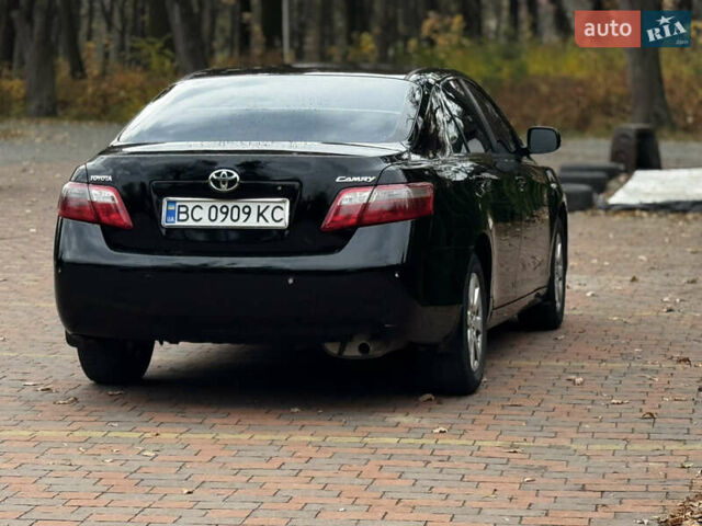 Черный Тойота Камри, объемом двигателя 2.36 л и пробегом 308 тыс. км за 7400 $, фото 2 на Automoto.ua