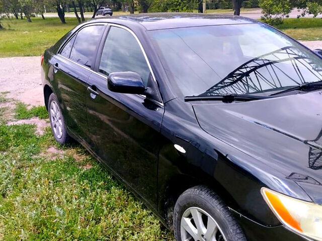 Черный Тойота Камри, объемом двигателя 2.4 л и пробегом 250 тыс. км за 6799 $, фото 1 на Automoto.ua