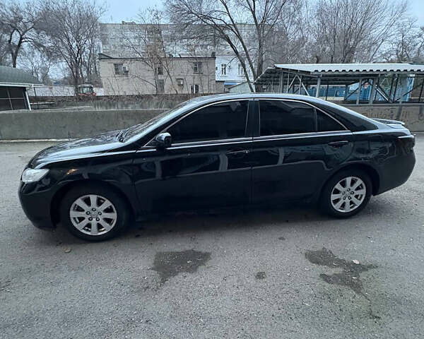 Черный Тойота Камри, объемом двигателя 2.36 л и пробегом 357 тыс. км за 6900 $, фото 1 на Automoto.ua