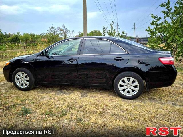 Черный Тойота Камри, объемом двигателя 2.4 л и пробегом 194 тыс. км за 8300 $, фото 1 на Automoto.ua