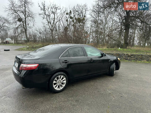 Черный Тойота Камри, объемом двигателя 2.4 л и пробегом 232 тыс. км за 6850 $, фото 7 на Automoto.ua