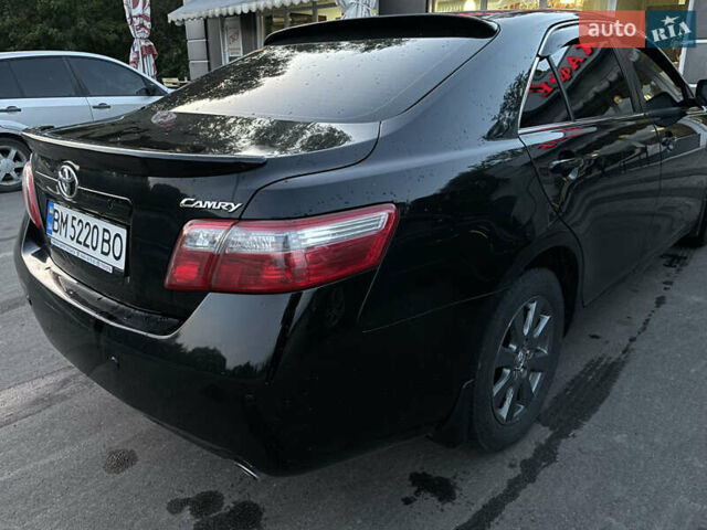 Черный Тойота Камри, объемом двигателя 2.36 л и пробегом 164 тыс. км за 8900 $, фото 1 на Automoto.ua