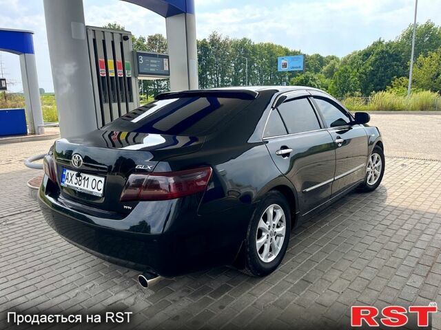 Черный Тойота Камри, объемом двигателя 2.4 л и пробегом 320 тыс. км за 8000 $, фото 1 на Automoto.ua