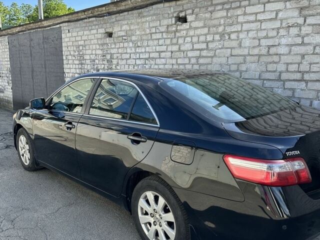 Черный Тойота Камри, объемом двигателя 2.4 л и пробегом 176 тыс. км за 9000 $, фото 1 на Automoto.ua