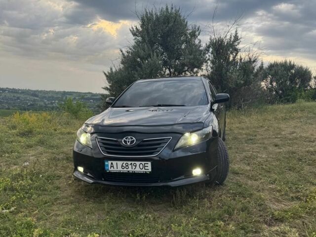 Черный Тойота Камри, объемом двигателя 2.4 л и пробегом 299 тыс. км за 9300 $, фото 1 на Automoto.ua