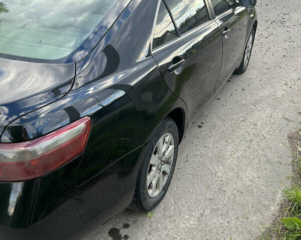 Черный Тойота Камри, объемом двигателя 2.4 л и пробегом 306 тыс. км за 8000 $, фото 11 на Automoto.ua