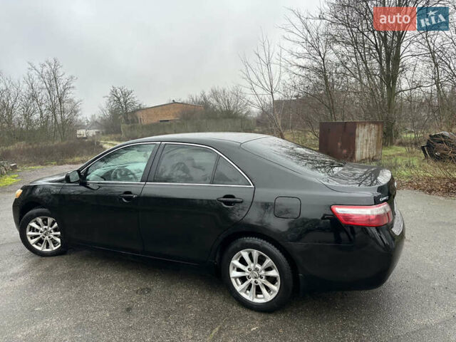 Черный Тойота Камри, объемом двигателя 2.4 л и пробегом 232 тыс. км за 6850 $, фото 2 на Automoto.ua