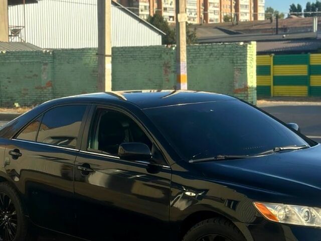 Черный Тойота Камри, объемом двигателя 2.4 л и пробегом 330 тыс. км за 8500 $, фото 3 на Automoto.ua