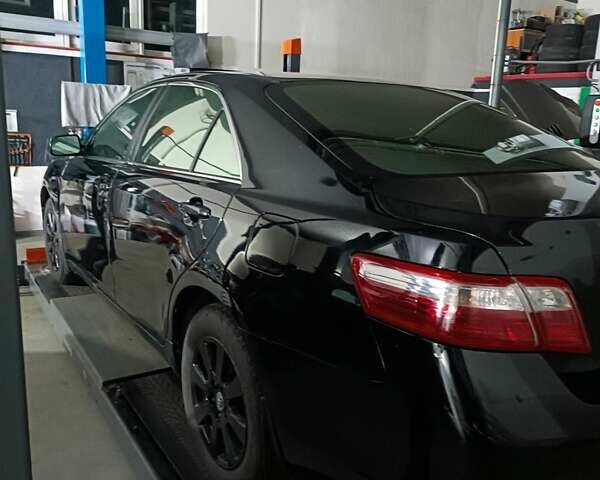 Черный Тойота Камри, объемом двигателя 3.46 л и пробегом 320 тыс. км за 8300 $, фото 1 на Automoto.ua
