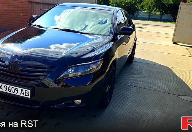 Черный Тойота Камри, объемом двигателя 2.4 л и пробегом 233 тыс. км за 8500 $, фото 1 на Automoto.ua