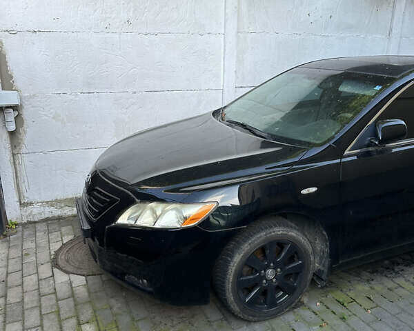 Чорний Тойота Камрі, об'ємом двигуна 2.36 л та пробігом 340 тис. км за 10500 $, фото 1 на Automoto.ua