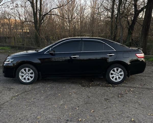 Черный Тойота Камри, объемом двигателя 2.4 л и пробегом 366 тыс. км за 6500 $, фото 1 на Automoto.ua