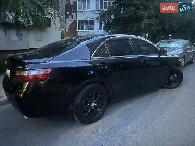 Чорний Тойота Камрі, об'ємом двигуна 2.4 л та пробігом 200 тис. км за 10200 $, фото 1 на Automoto.ua