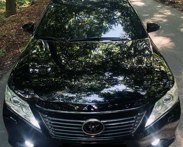 Черный Тойота Камри, объемом двигателя 2.5 л и пробегом 250 тыс. км за 13000 $, фото 1 на Automoto.ua
