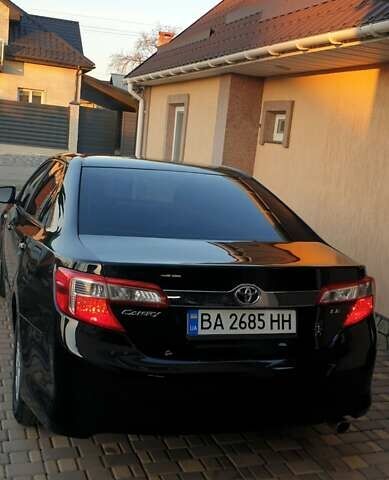 Черный Тойота Камри, объемом двигателя 2.5 л и пробегом 154 тыс. км за 9490 $, фото 28 на Automoto.ua