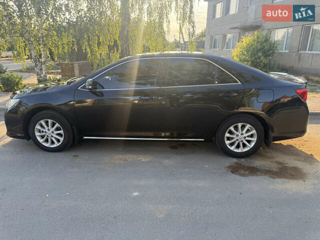 Чорний Тойота Камрі, об'ємом двигуна 2.49 л та пробігом 208 тис. км за 13500 $, фото 19 на Automoto.ua