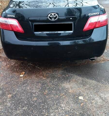 Черный Тойота Камри, объемом двигателя 2.36 л и пробегом 248 тыс. км за 10500 $, фото 1 на Automoto.ua