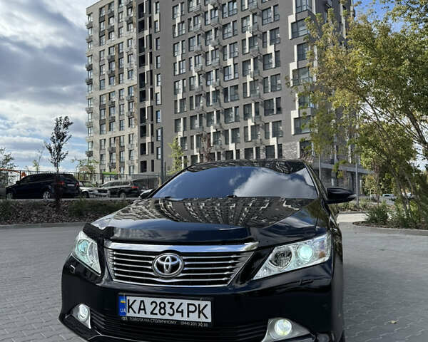 Черный Тойота Камри, объемом двигателя 2.49 л и пробегом 210 тыс. км за 13500 $, фото 1 на Automoto.ua