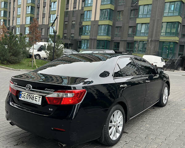Черный Тойота Камри, объемом двигателя 3.46 л и пробегом 217 тыс. км за 13500 $, фото 11 на Automoto.ua