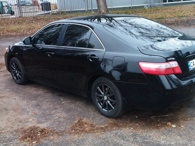 Черный Тойота Камри, объемом двигателя 2.4 л и пробегом 248 тыс. км за 10500 $, фото 1 на Automoto.ua