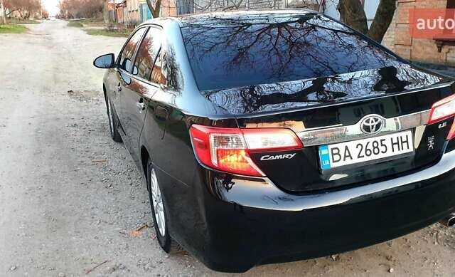 Черный Тойота Камри, объемом двигателя 2.5 л и пробегом 154 тыс. км за 9490 $, фото 21 на Automoto.ua