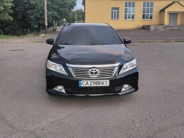 Черный Тойота Камри, объемом двигателя 2.5 л и пробегом 263 тыс. км за 13200 $, фото 1 на Automoto.ua