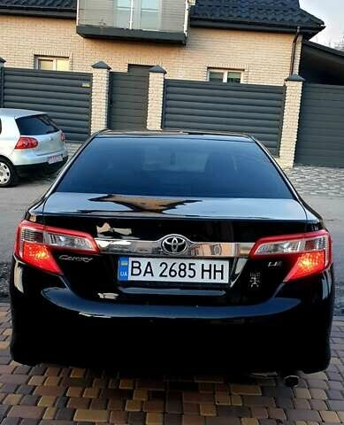 Черный Тойота Камри, объемом двигателя 2.5 л и пробегом 154 тыс. км за 9490 $, фото 1 на Automoto.ua