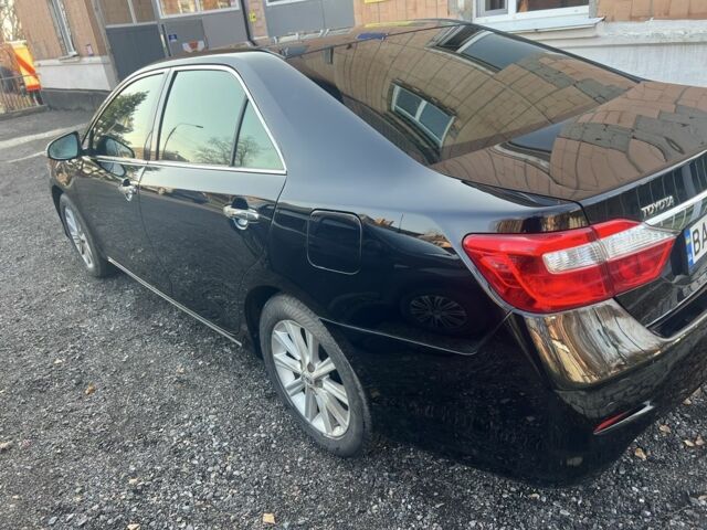 Чорний Тойота Камрі, об'ємом двигуна 2.5 л та пробігом 190 тис. км за 14000 $, фото 1 на Automoto.ua