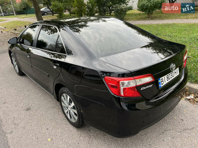 Чорний Тойота Камрі, об'ємом двигуна 2.5 л та пробігом 152 тис. км за 12700 $, фото 2 на Automoto.ua