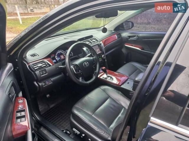 Чорний Тойота Камрі, об'ємом двигуна 2.5 л та пробігом 130 тис. км за 15900 $, фото 1 на Automoto.ua