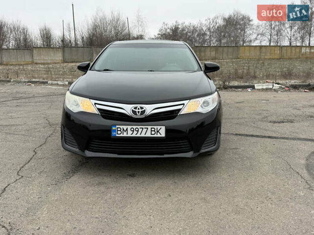 Черный Тойота Камри, объемом двигателя 2.5 л и пробегом 186 тыс. км за 12600 $, фото 1 на Automoto.ua