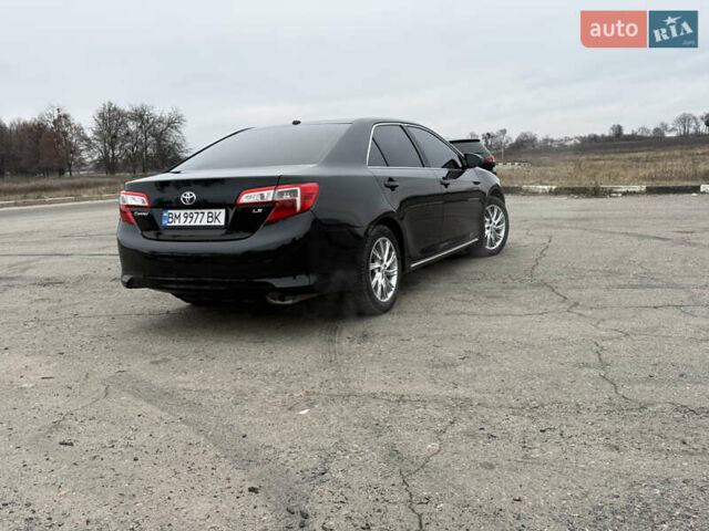 Черный Тойота Камри, объемом двигателя 2.5 л и пробегом 186 тыс. км за 12600 $, фото 7 на Automoto.ua