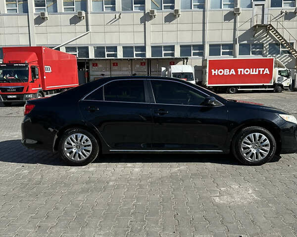 Черный Тойота Камри, объемом двигателя 2.49 л и пробегом 142 тыс. км за 11500 $, фото 1 на Automoto.ua