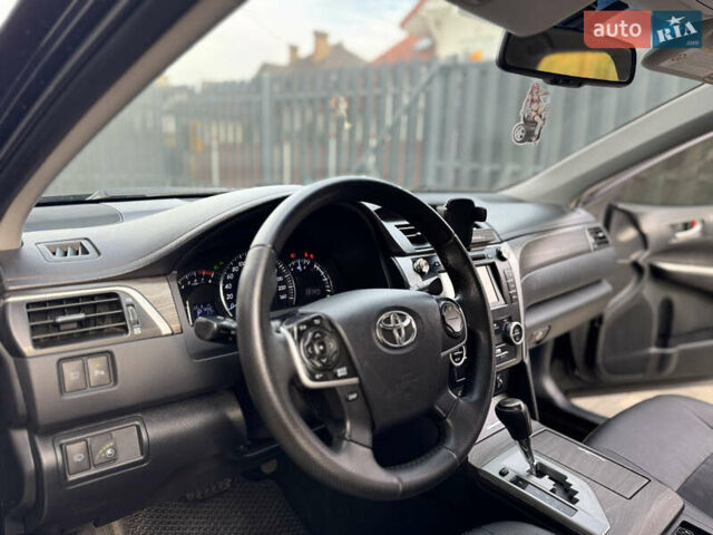 Черный Тойота Камри, объемом двигателя 2.5 л и пробегом 255 тыс. км за 13500 $, фото 19 на Automoto.ua