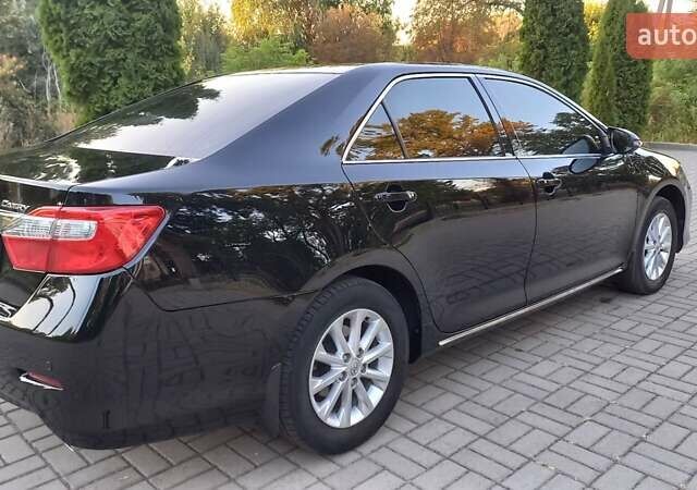 Черный Тойота Камри, объемом двигателя 2.49 л и пробегом 188 тыс. км за 12700 $, фото 2 на Automoto.ua