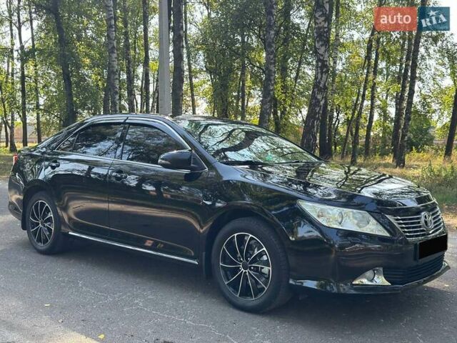 Чорний Тойота Камрі, об'ємом двигуна 2.5 л та пробігом 163 тис. км за 13199 $, фото 1 на Automoto.ua