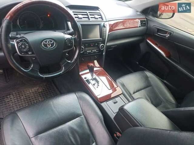 Черный Тойота Камри, объемом двигателя 2.5 л и пробегом 185 тыс. км за 13200 $, фото 1 на Automoto.ua