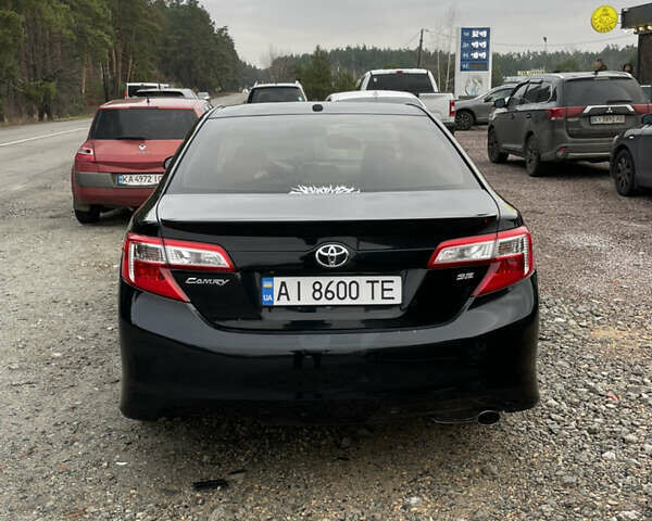 Черный Тойота Камри, объемом двигателя 2.5 л и пробегом 252 тыс. км за 10500 $, фото 7 на Automoto.ua