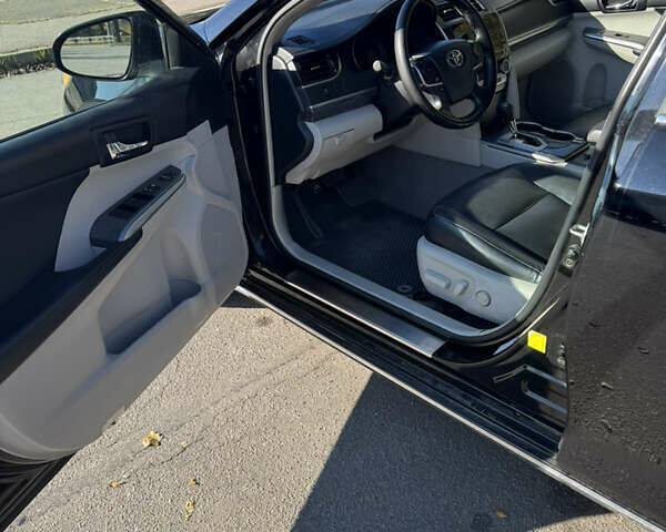 Черный Тойота Камри, объемом двигателя 2.49 л и пробегом 215 тыс. км за 13800 $, фото 3 на Automoto.ua