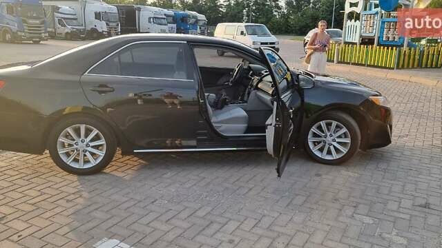 Черный Тойота Камри, объемом двигателя 2.49 л и пробегом 255 тыс. км за 13400 $, фото 2 на Automoto.ua