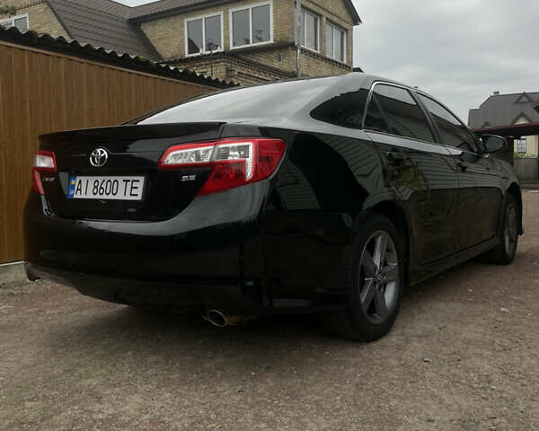 Черный Тойота Камри, объемом двигателя 2.5 л и пробегом 252 тыс. км за 10500 $, фото 1 на Automoto.ua