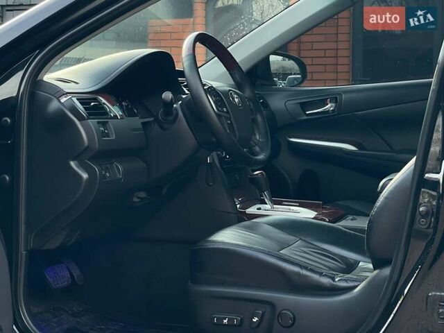 Черный Тойота Камри, объемом двигателя 2.49 л и пробегом 216 тыс. км за 13999 $, фото 12 на Automoto.ua
