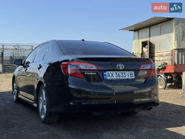 Чорний Тойота Камрі, об'ємом двигуна 2.49 л та пробігом 245 тис. км за 12200 $, фото 3 на Automoto.ua